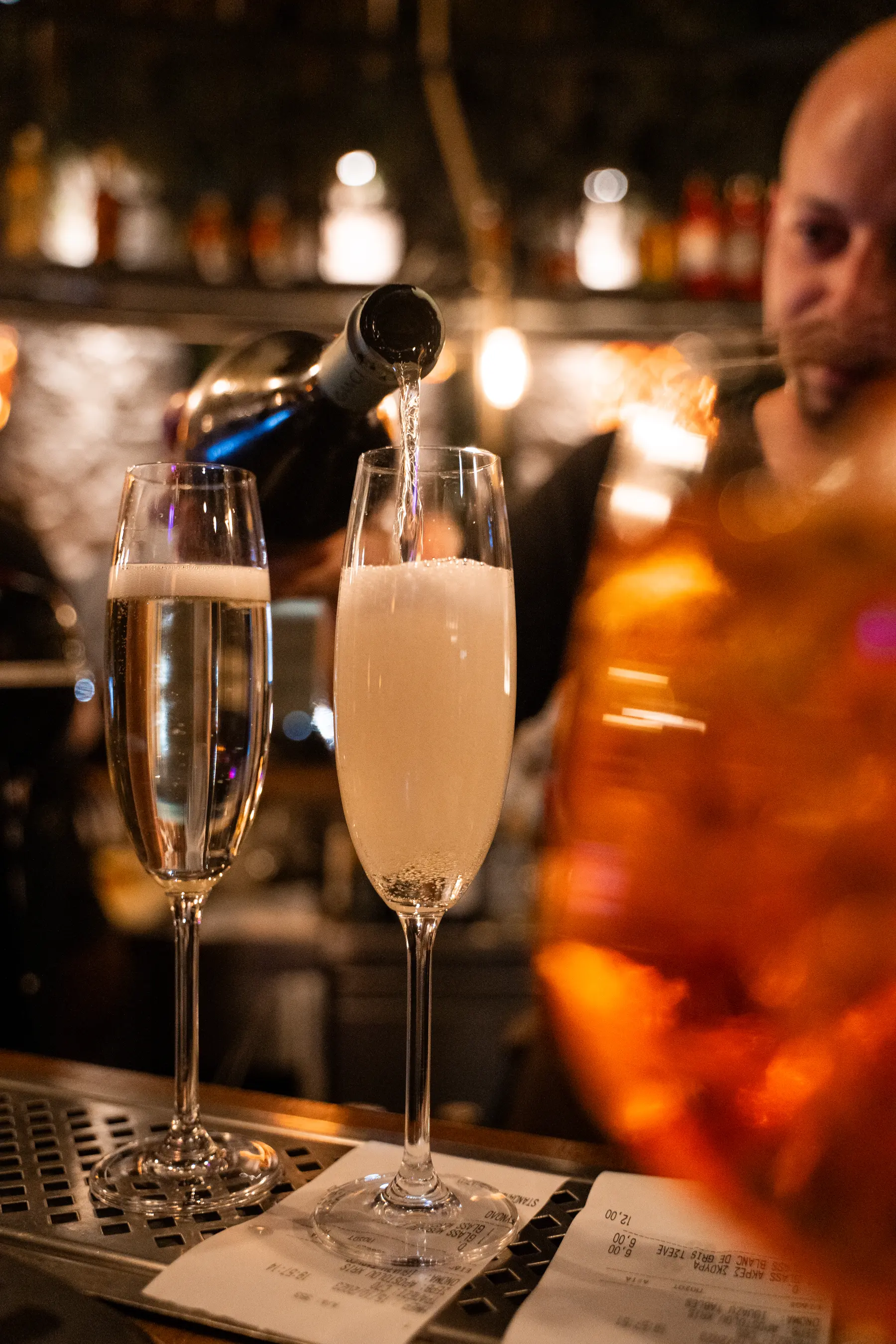 Champagne being poured at a birthday party at Iguazu Athens