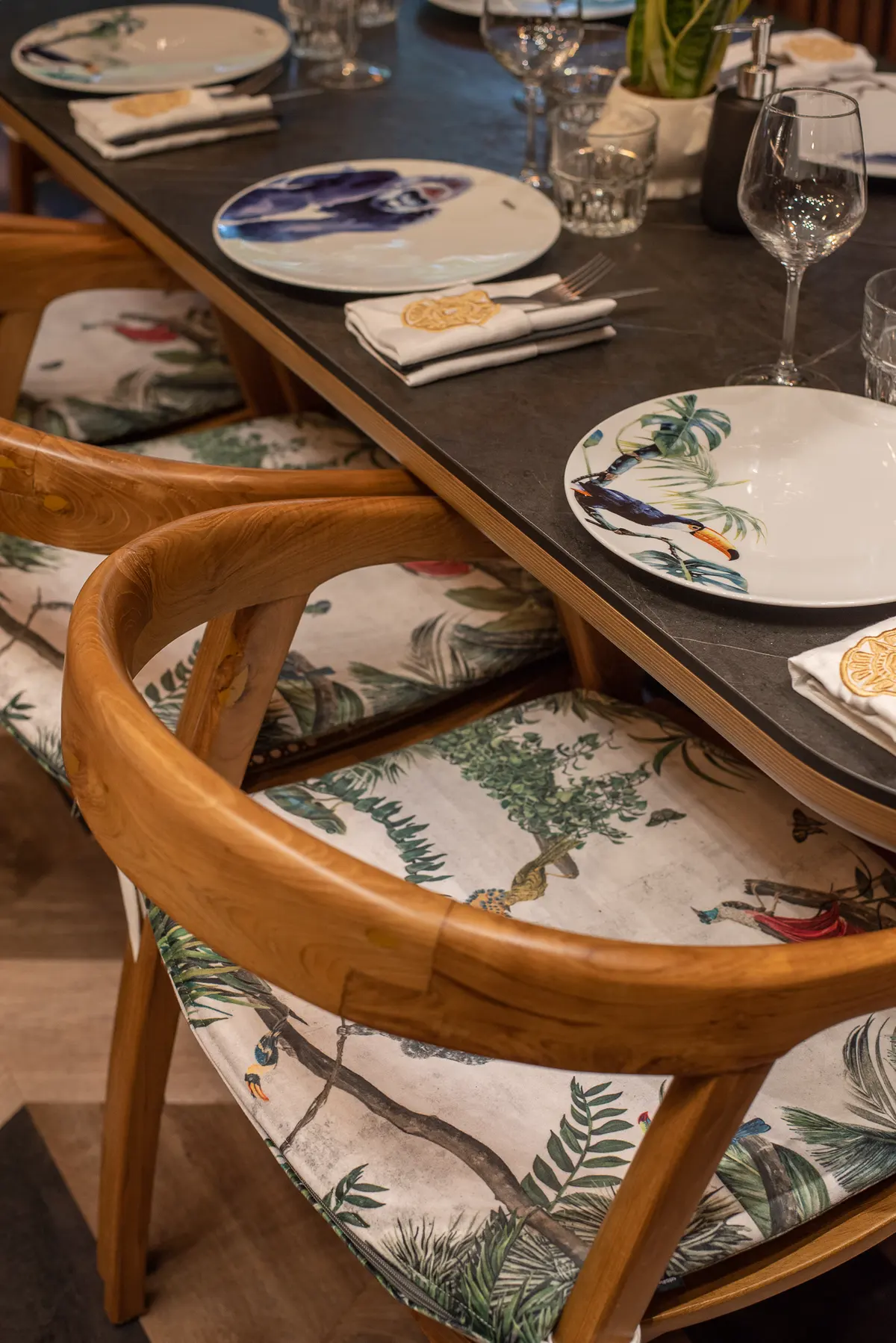 Botanical-print upholstery on a dining chair at Iguazu Athens