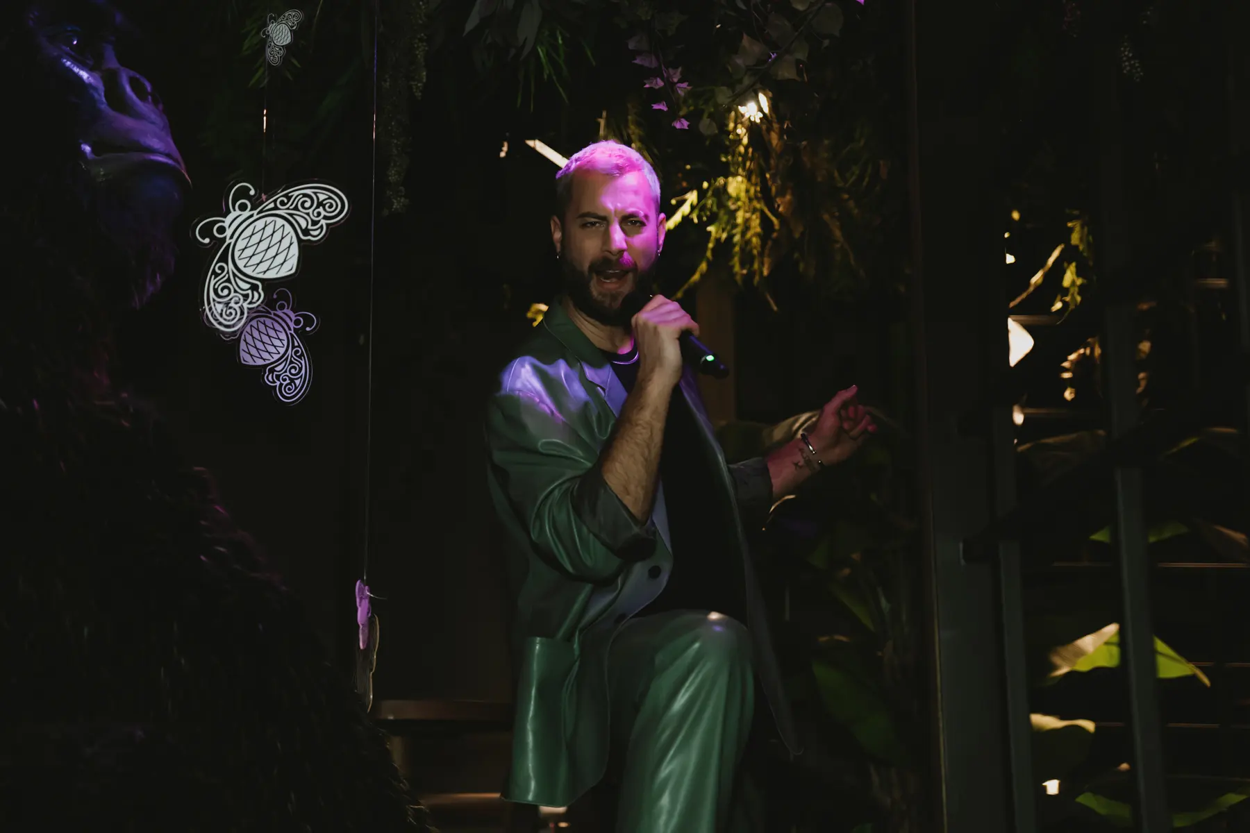 A speech on the microphone in front of the guests at a private dinner at Iguazu Athens