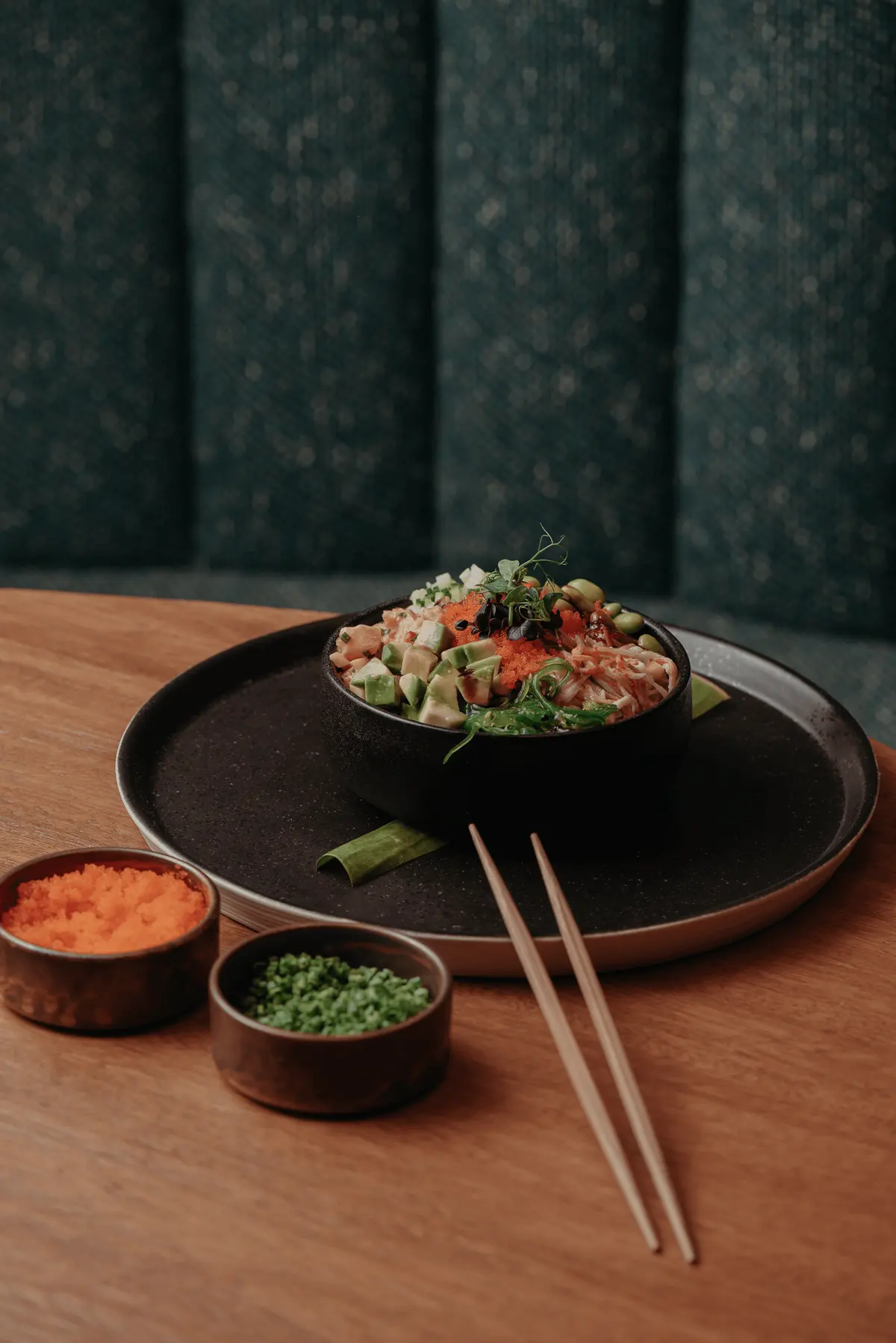 Poke bowl served with side condiments at Iguazu Athens