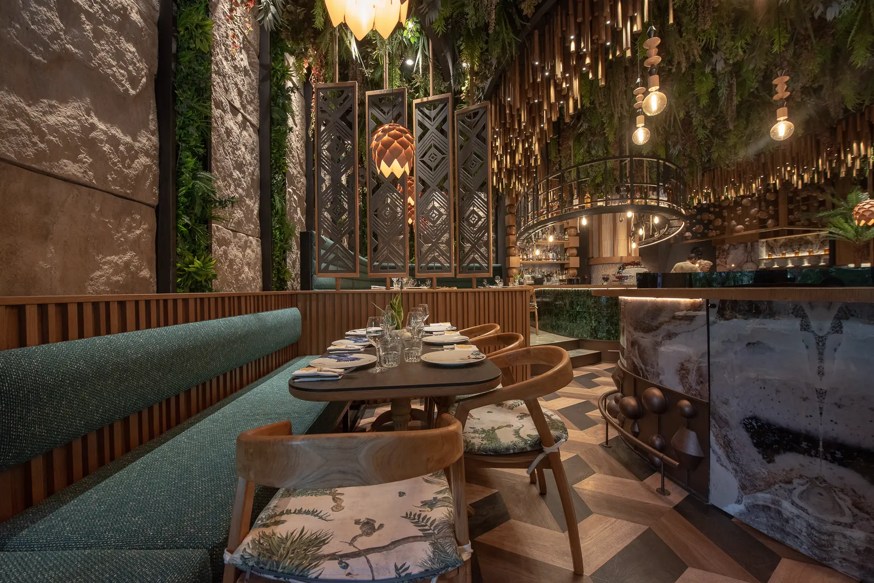 A booth table laid for dinner at Iguazu Athens