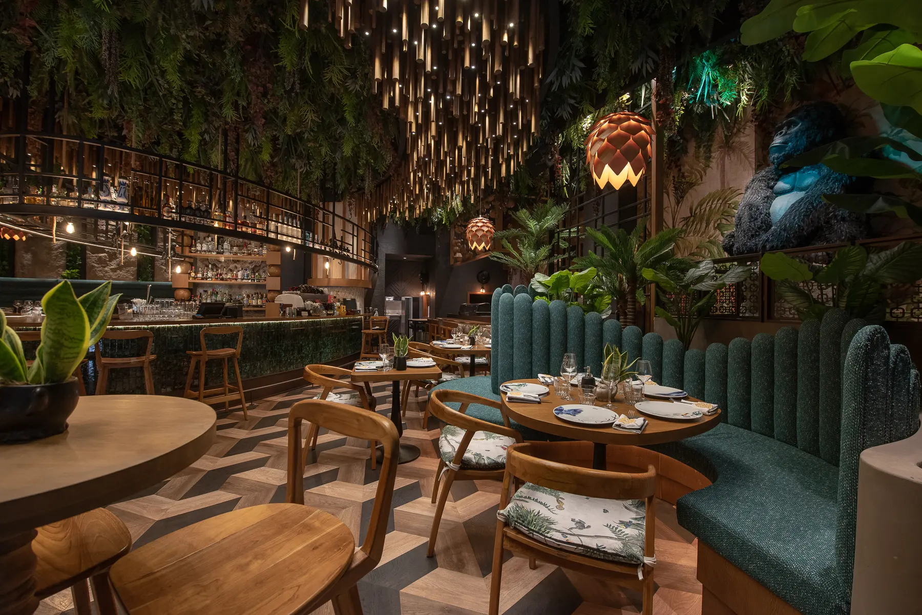 The moss and fern wall in the dining room at Iguazu Athens
