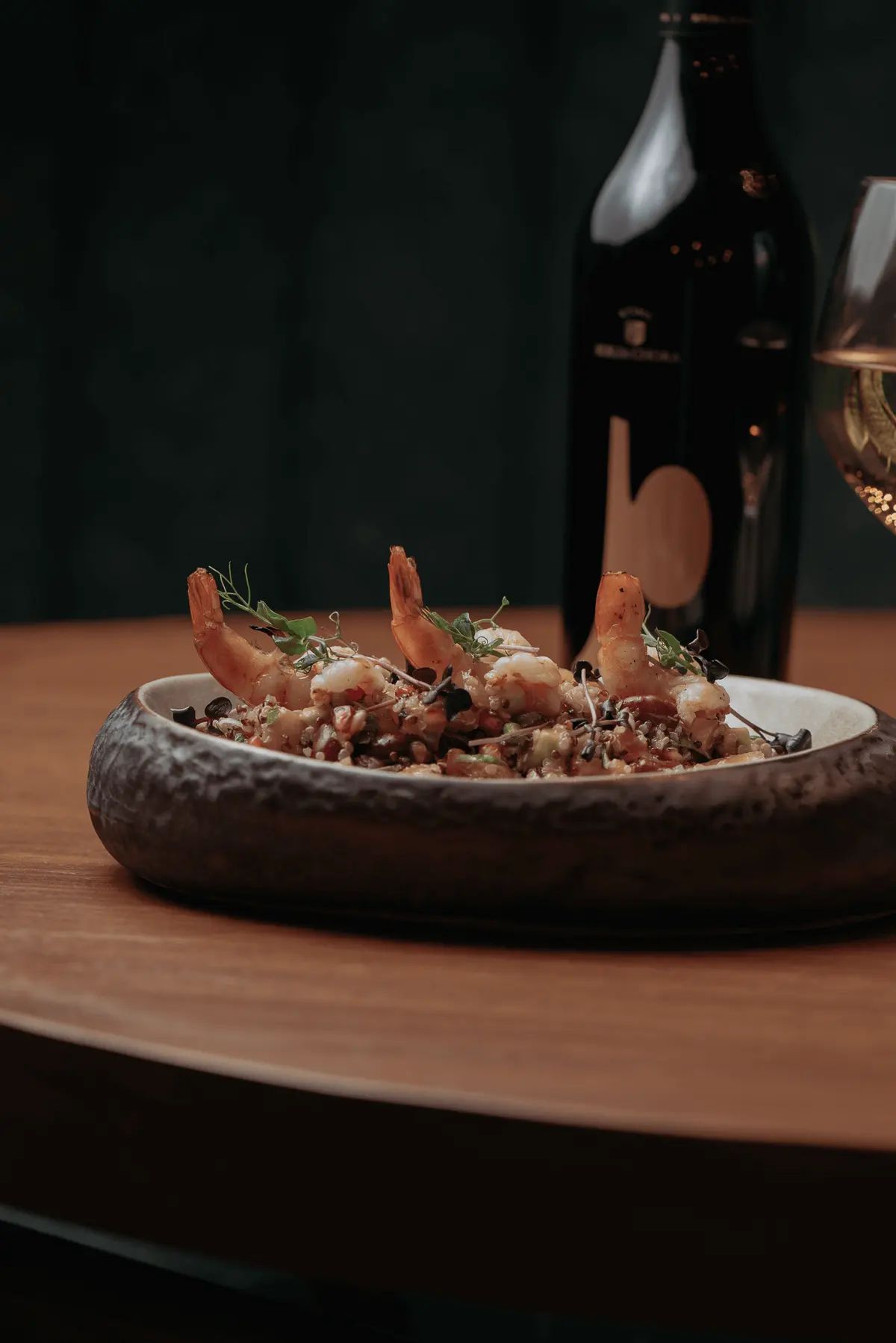Prawns served over grains in a stone bowl at Iguazu Athens