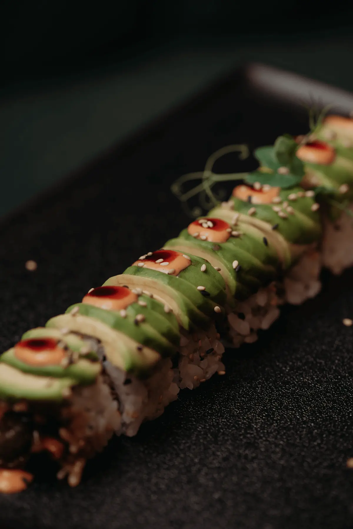 Close-up of an avocado-topped Brazilian sushi roll