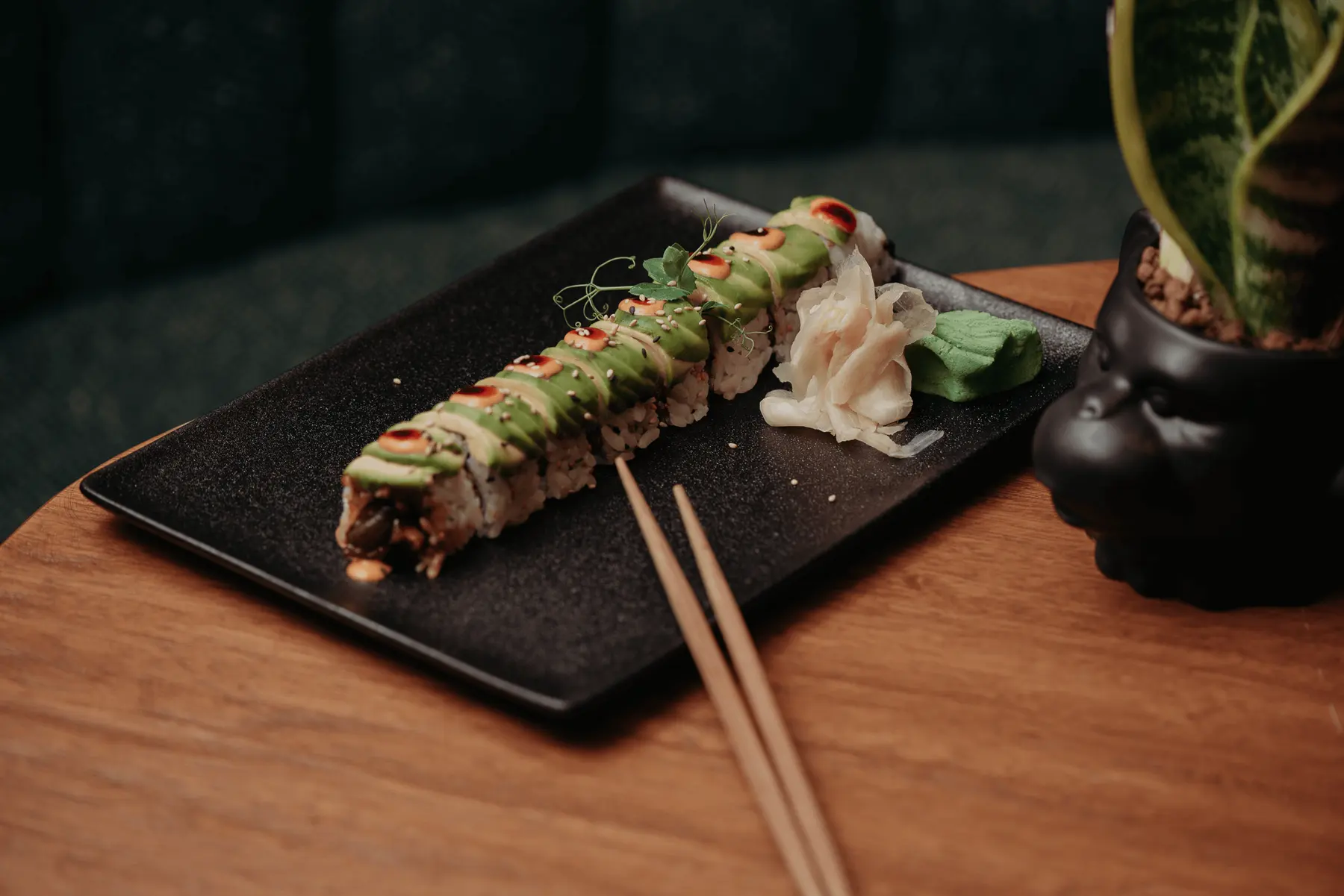 A Brazilian sushi roll plated with pickled ginger