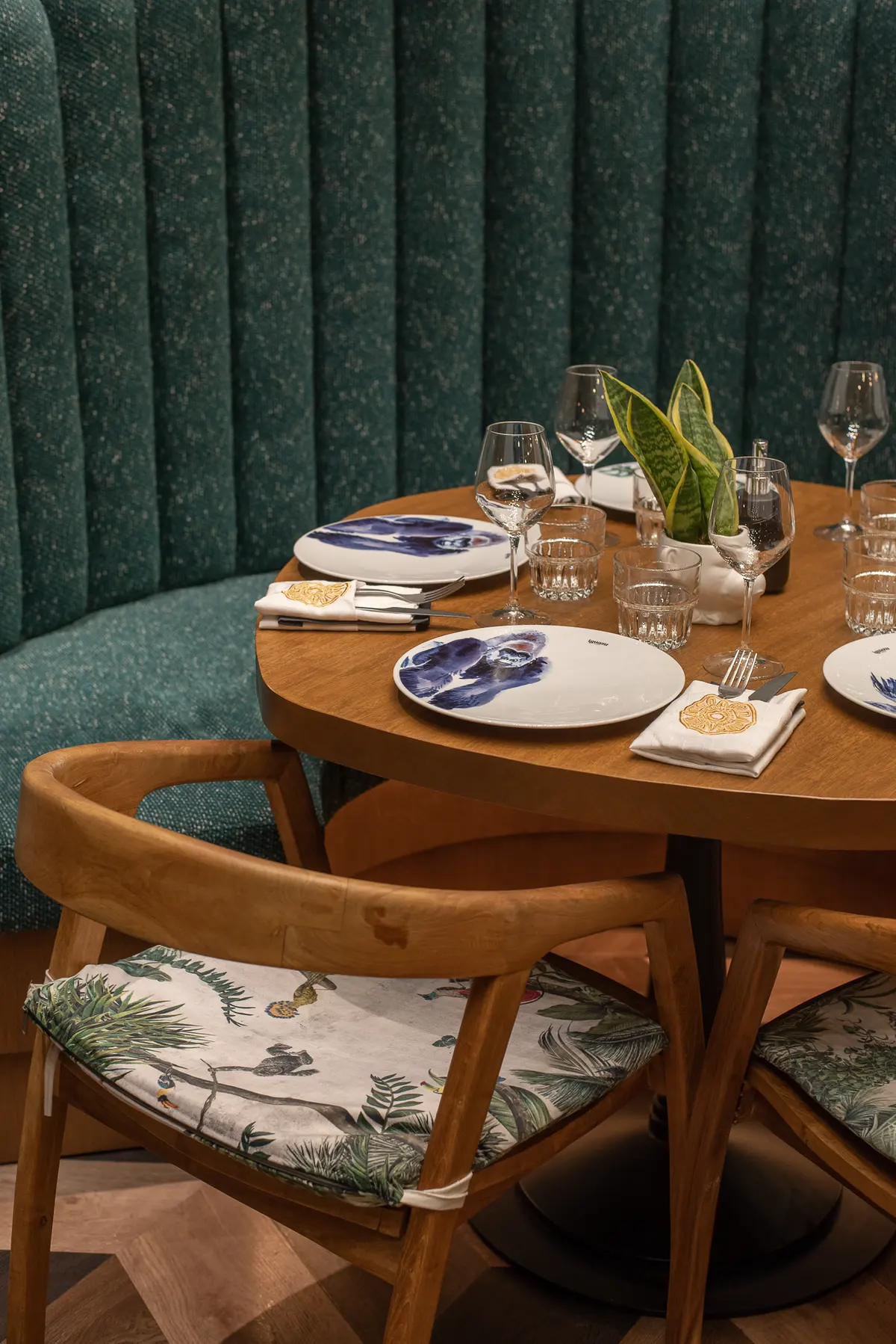 A table laid with patterned plates and glassware at Iguazu Athens