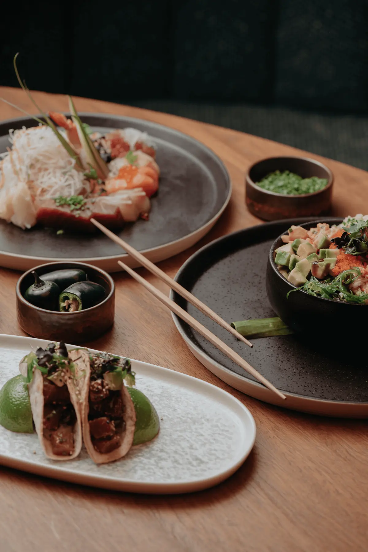 Tacos plated with charred lime at Iguazu Athens